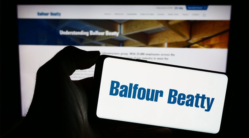 Balfour Beatty logo on phone screen and laptop