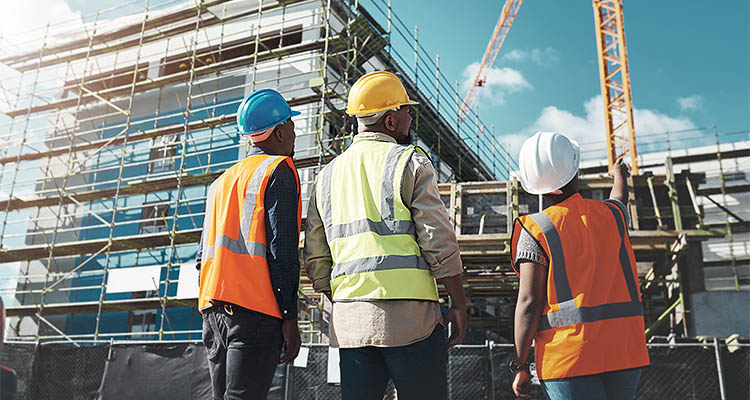 Construction, engineer team and building project with people planning development and architecture. Black woman and men together for project management, engineering and assessment outdoor in city.