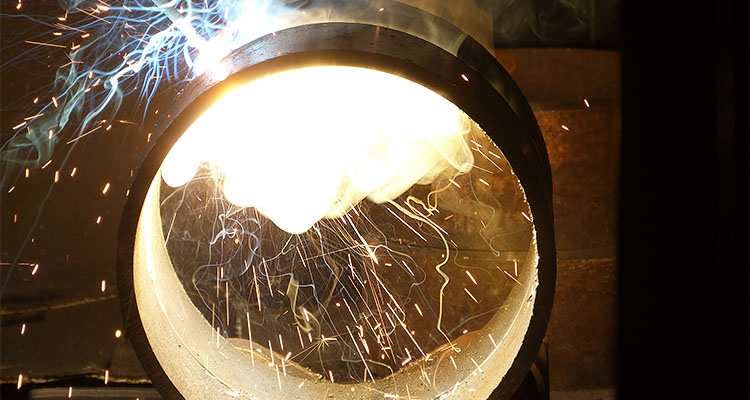 welding process on a large, circular metal object