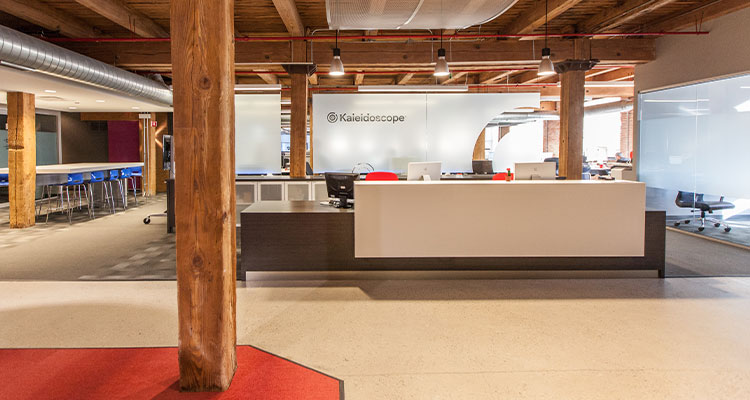 he interior of a modern office space, specifically the reception area of a building named Kaleidoscope.