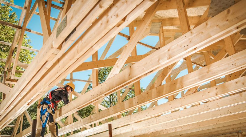 Stacks of lumber at a construction site in the US, affected by newly announced tariffs