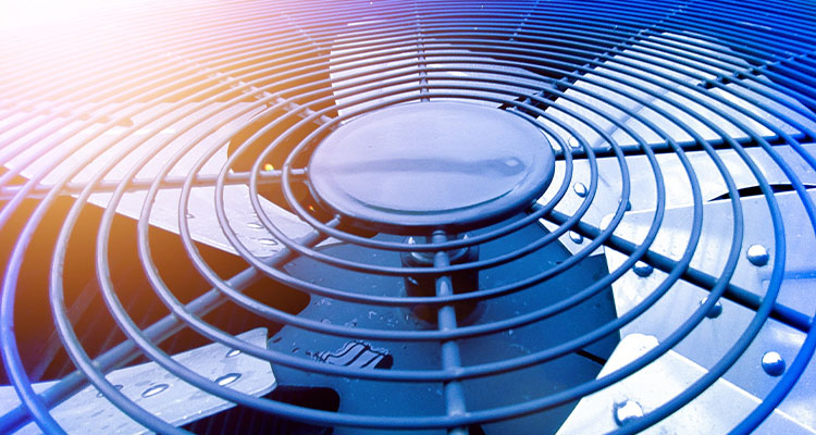 a close-up of an outdoor HVAC unit's exhaust fan