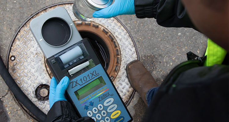 a person using a Zeltex ZX-101XL portable fuel analyzer