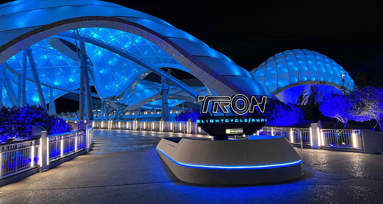 the entrance area of the TRON Lightcycle / Run roller coaster attraction at a Disney theme park