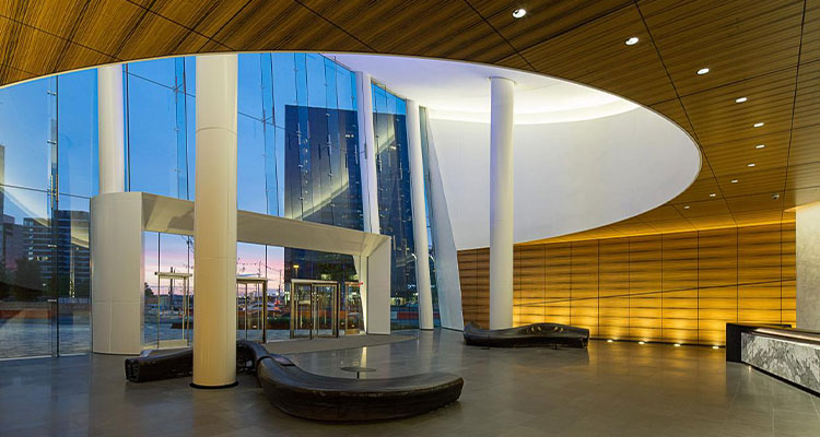 the modern, elliptical lobby of the 121 Seaport office building in Boston, Massachusetts
