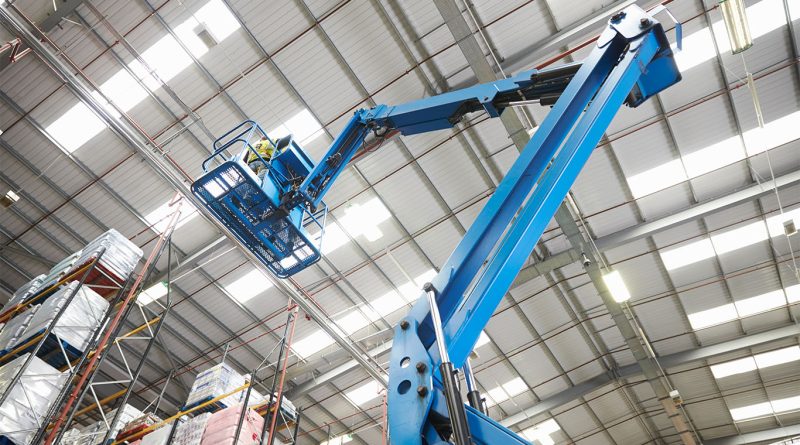 man lifts in warehouse